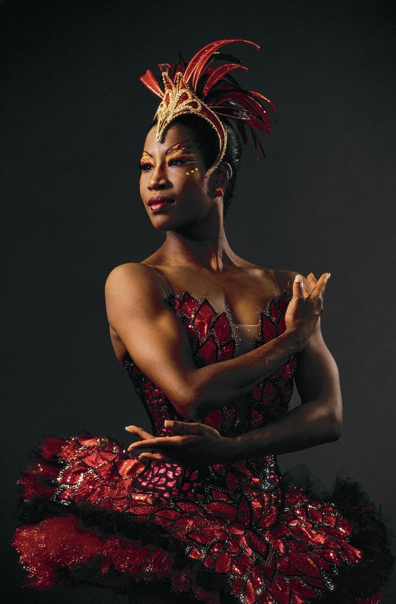 Lauren Anderson in a Firebird red tutu and headpiece. Her arms cross across her chest